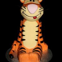 Tigger Stacked and carved vanilla buttercake, covered in chocolate ganache and fondant, he's not perfect, but I'm really pleased with...