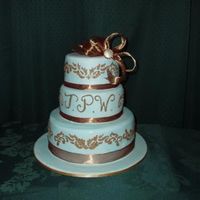 Blue And Gold White chocolate cake with strawberry buttercream filling, covered in fondant. First attempt at stencilling, but I really enjoyed this...