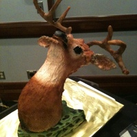Grooms Cake This is a groom's cake. The plaque is chocolate cake with fondant, the deer head is chocolate cake with ganache and cereal treat...