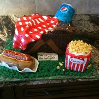 Take Me Out To The Ballgame.... 100% edible. The basket was cake, peanuts were gumpaste, blanket was fondant, hot dog was cereal treat as was the popcorn bucket and the...