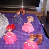 Cupcakes these went with the barbie cake, they are cup cakes with fondant and butter cream(this is were i found out children hate fondant) but they...