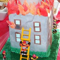 Rescue Heroes Birthday Cake Son's 4th B-day party w/Rescue Hereos theme. Have only decorated 3 cakes in my life, this was #2. Building is four 6-inch square cakes...