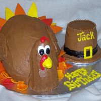 3Dturkey2.jpg made for a little guy whose birthday fell on thanksgiving. buttercream with fondant feathers