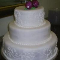 Dress Matching Wedding Cake The piping on this cake was done to match the design on the bride's dress.