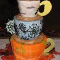 Halloween Wedding Coffee Cup Cake This was done for a wedding in which the bride wanted the cakes shapped like coffee cups. She had specific "themes" for each cup...