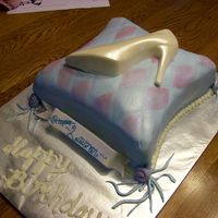 Princess Pillow Cake My first pillow cake. 2 10" squares, carved. Covered in MMF. All brushed with sparkle dust. White chocolate high heel with pearl dust...