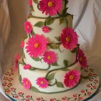 Fuchsia Daisy Cake My very first wedding cake. The top layers are foam.The bottom is red velvet. Thanks for looking!