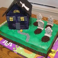 Haunted House Sheet cake with a gingerbread haunted house (my first ever), and chocolate accents.