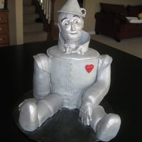 The Tin Man RKT head, arms legs. Cake body, all covered in fondant. Gumpaste funnel hat.