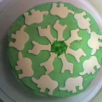 Elephants And Giraffes Yellow cake with green buttercream frosting and fondant cutouts. In my mind it was so much cuter!