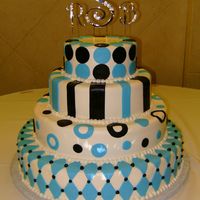 Arnaldocake.jpg Buttercream iced wedding cake with fondant accents