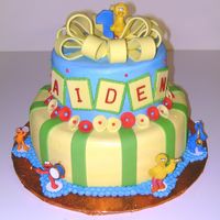 Aiden's First Birthday Cake iced with buttercream and trimmed with fondant