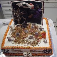 My First Halloween Cake! This one is totally my own original Idea. The Book and All the figures are hand sculpted form candy clay (the recipie I found here) and the...