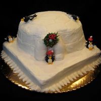 Igloo Cake I0" square with upside down bundt cake. All butter cream including penguins and wreath.