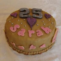 25Th Birthday Cake Caramel cake with chocolate accents and pink pearl dust.