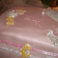 A Girl's On The Way White cake layered with lemon filling and iced in pink fondant. Adorned with the stork and a few necessities (in pink) which an expectant...