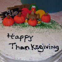 My First Thanksgiving Cake Spice cake (recipes found on here) with cream cheese icing, fondant pimkin and turkey etc.