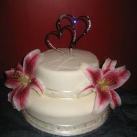 My First Wedding Cake! This is my first ever wedding cake and I am quite pleased with it. It was a voluntary cake I did as a gift for some friends of ours who...