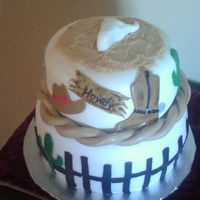 Western Cake Chocolate cake w/chocolate mousse & marble cake with chocolate mousseCowboy hat~ Rope~Boot w/spur~ Sheriff badge~Howdy sign~Cactus~...