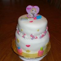 Bratzz.jpg Bratz Cake ~ Lemon cake with cream cheese filling. Lipstick, Nail polish, Perfume bottle & eyeshadow all made out of fondant. The...