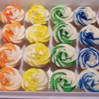 Rainbow Cupcakes Well I just let my imagination run wild w/these. Made them just for fun. White cake iced w/buttercream.