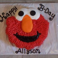 Elmo The face of elmo carved from a 10" pan and icedw/buttercream. I covered the eyes and nose in fondant. I used a star tip and pulled out...