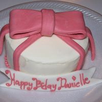 Pink Bow This was a 4" small cake made to go w/pink cupcakes for a child's school celabration. White cake iced w/buttercream and a fondant...
