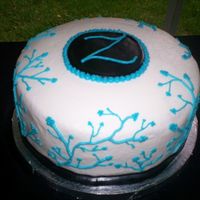 First Wedding Cake Buttercream with buttercream piping and fondant accents