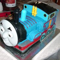 Thomas The Train I made this for my coworker's son's first birthday. They had the Thomas parts and had me make and decorate the cake. Chocolate...