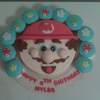 Myles Mario Bday Cake cake and cupcakes covered in condant w/fondant accents...he loved it :-)