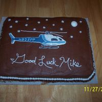 Helicopter Color Flow I made this cake for my boss who has left the unit. The helicopter is color flow and you can see how it cracked while trying to take it off...