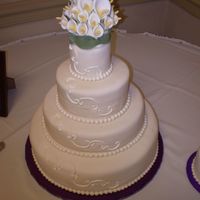 1St Wedding Cake Fondant covered chocolate/raspberry, white/raspberry, lemon poppy seed. Gumpast calla lilies.