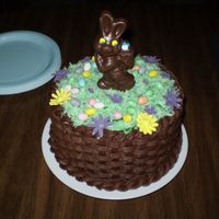 Easter Basket buttercream basket weave, coconut "grass", fondant and royal flowers, candy eggs and bunny.