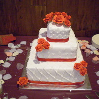 Red Roses Wedding Cake Gumpaste roses on buttercream.