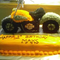 Harley Davidson 1St Birthday Cake For Our Neighbour Hand carved from chocolate pound cake. Covered with starred buttercream. Accented with bendy black straws and a face plate from our local...