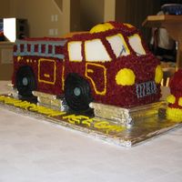 My Nephew's 2Nd Birthday Fire Truck Cake Made from a flat Wilton fire Truck cake pan X 2. One side is chocolate pound cake and the other side is chocolate pound cake. I then cut...