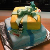 First Gift Box Cake French Vanilla Cakes covered in MMF with bow & dusted with Wilton's Shimmer Dust. Original large bow fell apart so I had to...