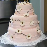 White Chocolate Fondant Wedding Cake French Vanilla 3 tiered cake covered with white chocolate fondant and gum paste flowers. This is my first fondant wedding cake I made for...