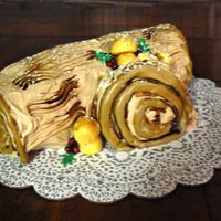 Yule Log Cake Pumpkin Roll with Cream Cheese filling & Mocha BC icing. Fondant berries, leaves & mushrooms. Dusted with PS.