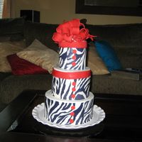My Birthday Cake Godiva white chocolate liquer cake with vanilla buttercream. I covered it with zebra print icing sheets and topped it off with a red bow...