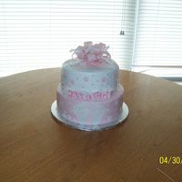 104_0374.jpg Baby shower cake with dots and footprints with bow.