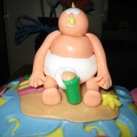 Beach Party Close up of the baby on top of the cake. The top baby had the coolest mohawk.