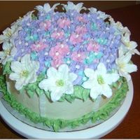 Mom's Birthday This was my first attempt at making royal icing lilies It was for my Mom's birthday. It was a 2 tier pina colada cake with pina colada...