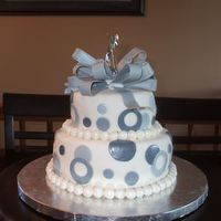 25Th Wedding Anniversary This is a 2 layer cake. The bottom is chocolate and the top layer is vanillla. A covered in fondant. The bow is made with gum paste.