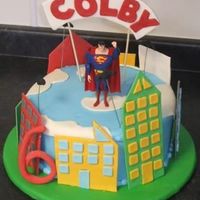 Superman A version of a cake that my client emailed to me to recreate with a few requested changes. Cake is in BC with gumpaste and fondant...