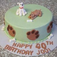 Puppies Cake frosted in BC with fondant paw prints and bones. Gumpaste puppies, these were my very first molded gumpaste figures - and I can't...