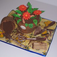 Flower Pot/ Gardening Cake EVERYTHING is sugar, tiles, "dirt", flower pots, everything.... there is a sand dollar on the front and shells in the pot because...