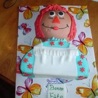 Raggedy Ann Cake for a friend's sister. Sports ball half on a 6 inch round for head. Body is 9 inch cake cut in half and stacked. Made a little...