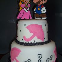 Princess Peach And Mario Bros This is fondant w/RI mario and princess peach. Her wedding colors were pink and black with an umbrella theme. The bride and groom are...