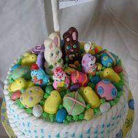 Easter Birthday Cake This was a 12 inch double layer cake iced with butter cream in a basket weave. I bought some donut holes filled with jelly and covered them...
